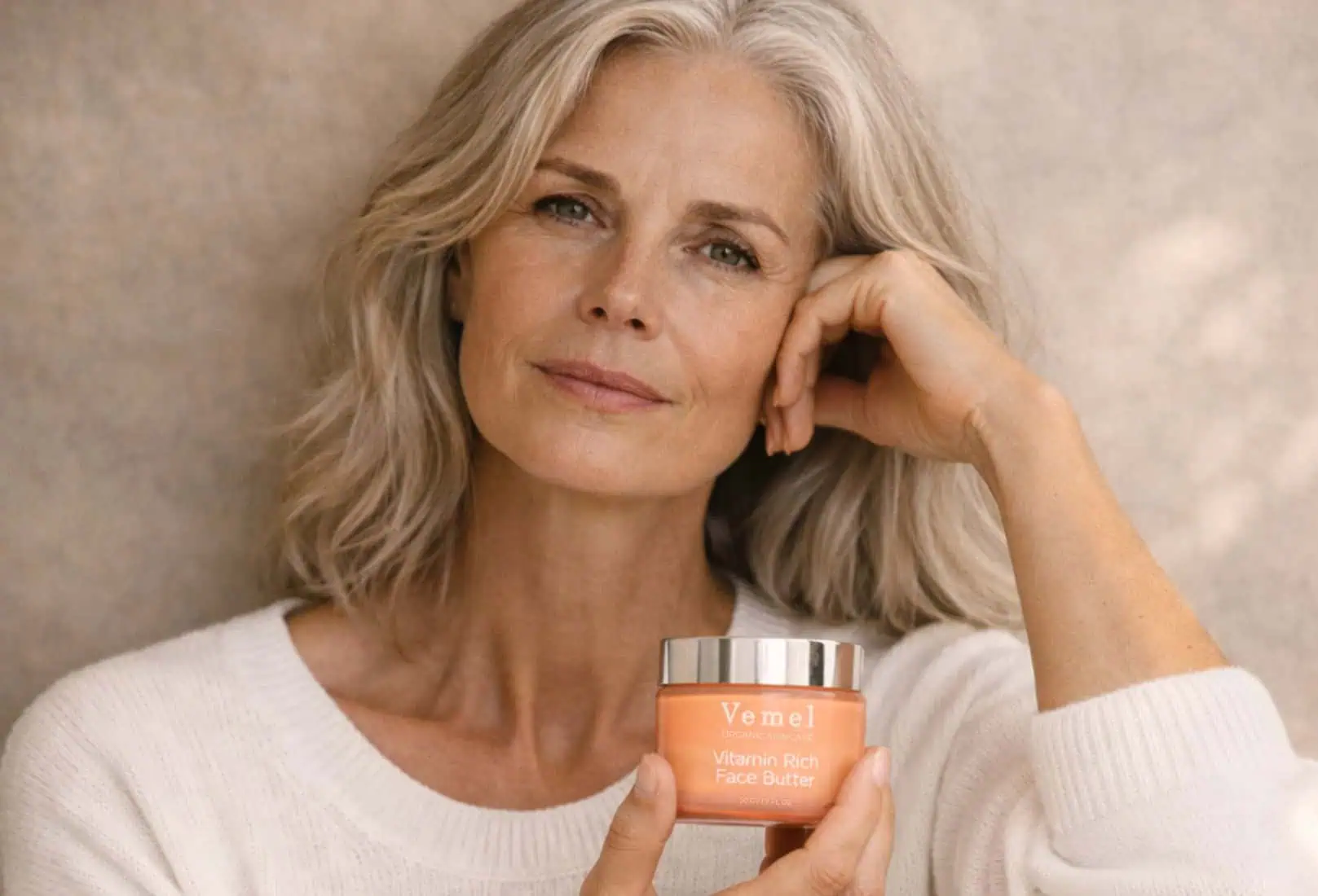 Woman holding Vitamin Rich Face Butter for menopausal skin support