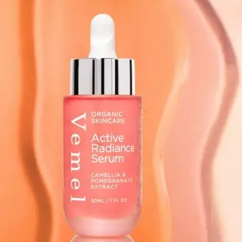 Applying Vemel Active Radiance Serum – clean organic skincare for radiant complexion