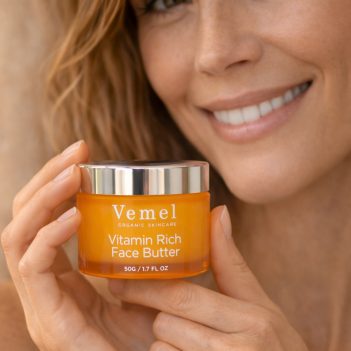 Model holding Vemel waterless organic Vitamin Rich Face Butter moisturiser